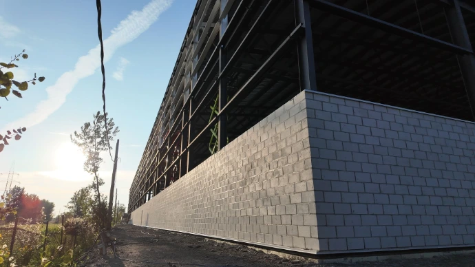 mur extérieur Isobloc bâtiment commercial maçonnerie isolée